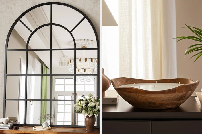 A minimalist vase with tulips and a decorative wooden bowl-shaped candle on display in a home setting